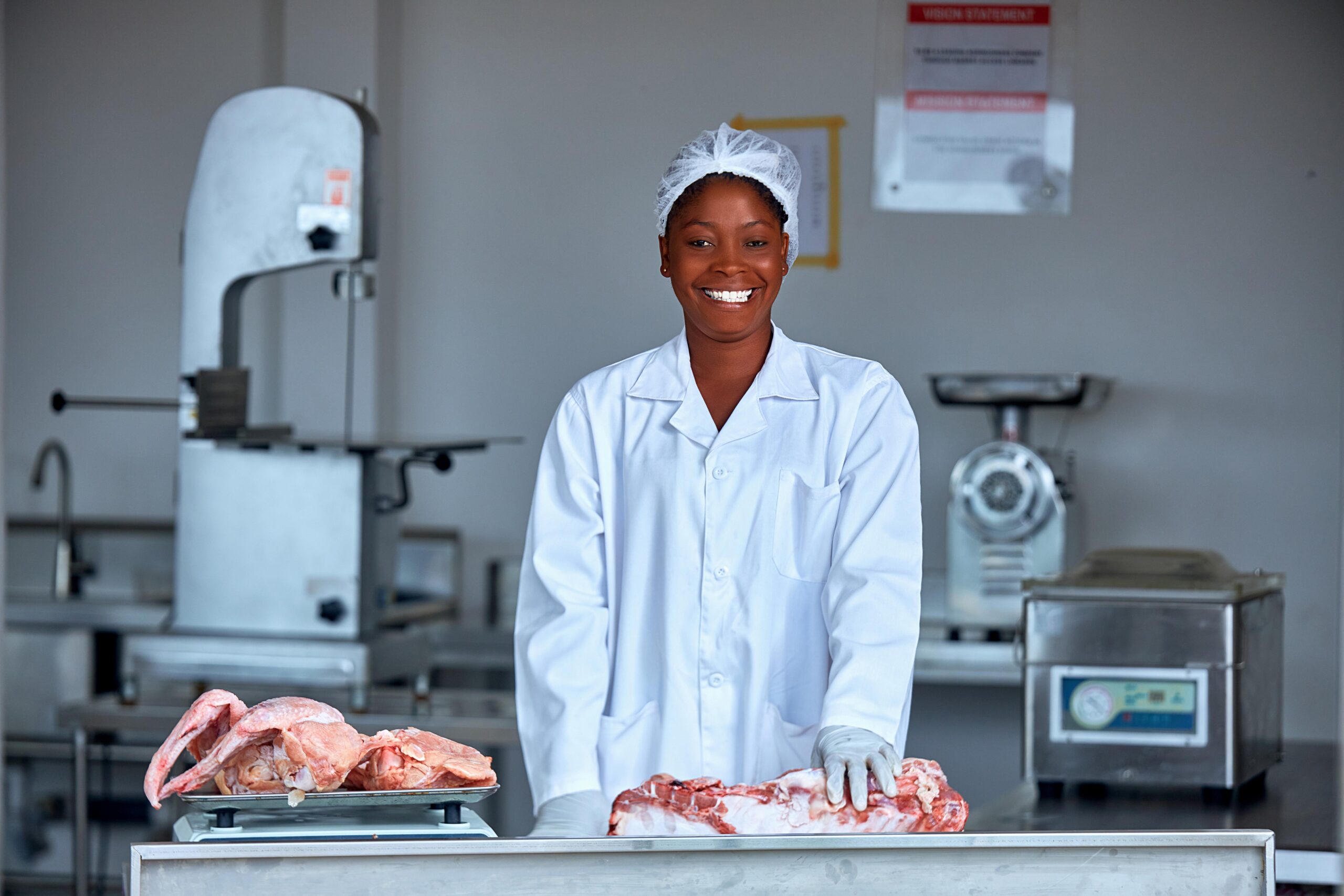 Student farmer holding a crate of vegetables